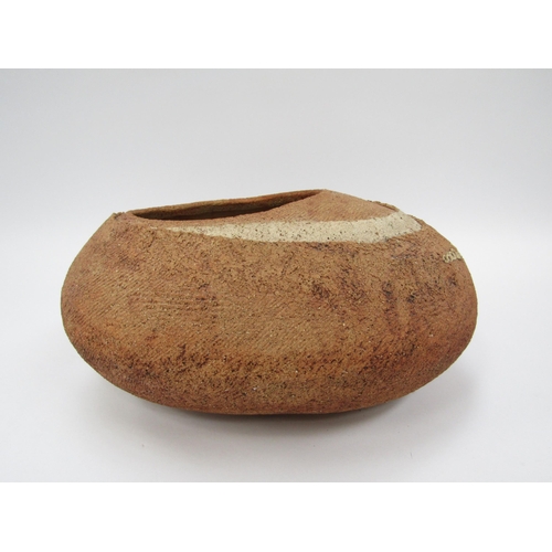 7097 - A pebble form planter pot by Nigel Edmondson, rough layered textured body. 33cm long