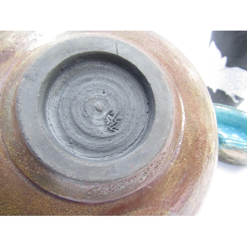 7099 - Three raku fired studio pottery vessels, potter's marks to bowls. Largest 18cm high