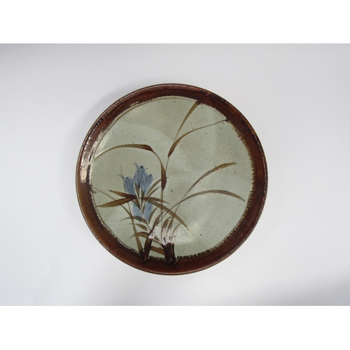 7100 - Large studio pottery dish with blue flowers and grass design. 37.5cm diameter    (C)