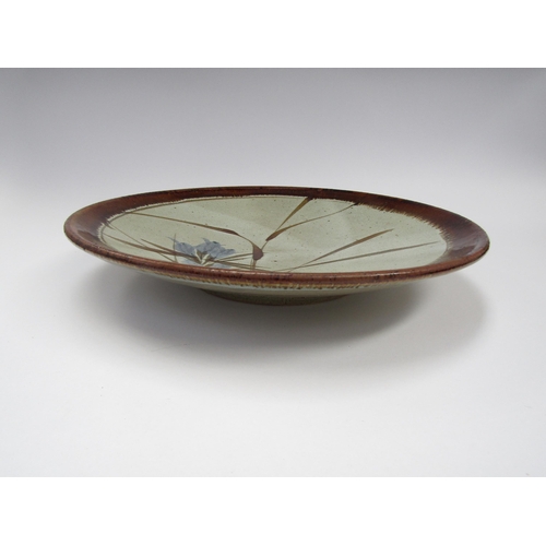 7100 - Large studio pottery dish with blue flowers and grass design. 37.5cm diameter    (C)