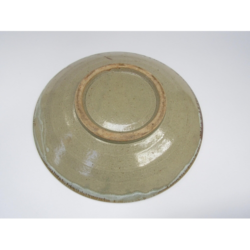 7100 - Large studio pottery dish with blue flowers and grass design. 37.5cm diameter    (C)