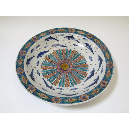 7101 - RUSSELL COATES (b.1949) A large studio porcelain bowl, the interior painted with sun motif surrounde... 