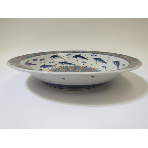 7101 - RUSSELL COATES (b.1949) A large studio porcelain bowl, the interior painted with sun motif surrounde... 