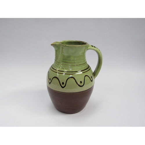 7103 - A Winchcombe Pottery large jug, green glazed upper section with slip detail. Impressed mark to base,... 