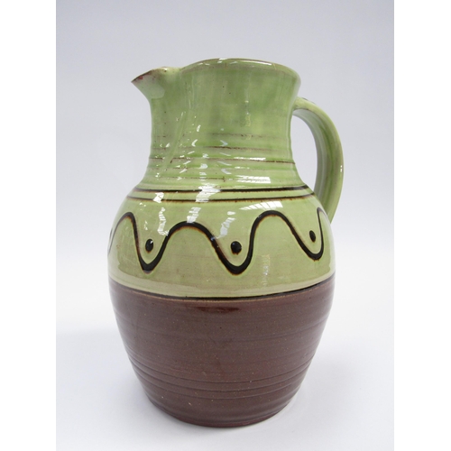 7103 - A Winchcombe Pottery large jug, green glazed upper section with slip detail. Impressed mark to base,... 