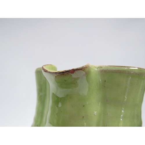 7103 - A Winchcombe Pottery large jug, green glazed upper section with slip detail. Impressed mark to base,... 