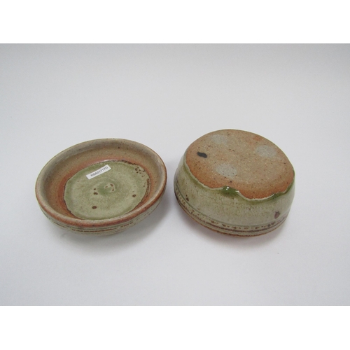 7104 - RICHARD BATTERHAM (1936-2021): A studio pottery stoneware lidded pot in green and brown ash glaze, 1... 