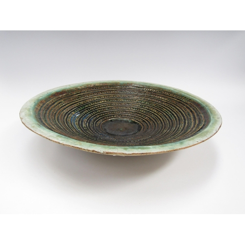 7105 - RUTH DUCKWORTH (1919-2009) A studio pottery large shallow bowl with maised line and dot detail. Pain... 