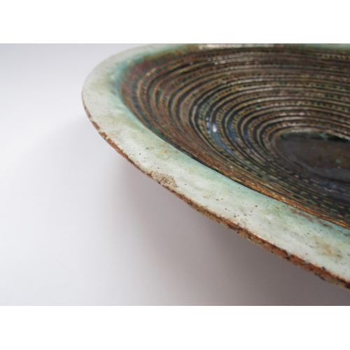 7105 - RUTH DUCKWORTH (1919-2009) A studio pottery large shallow bowl with maised line and dot detail. Pain... 