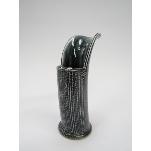 7108 - WALTER KEELER (b.1942) A studio pottery blue salt glazed pourer. Potters circle stamp. 13.5cm high