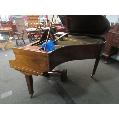 1012 - A Kent & Cooper Ltd. (Lincoln) mahogany Baby Grand piano on brass capped legs to castors