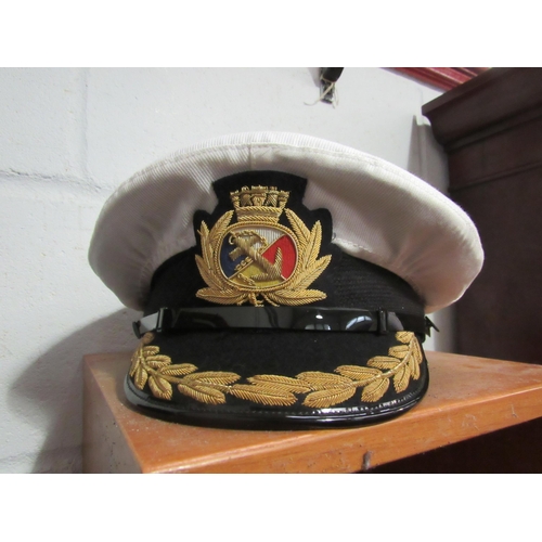 1024 - A Merchant Navy Captain's jacket with trousers, a peaked cap and epaulettes etc    E10-20