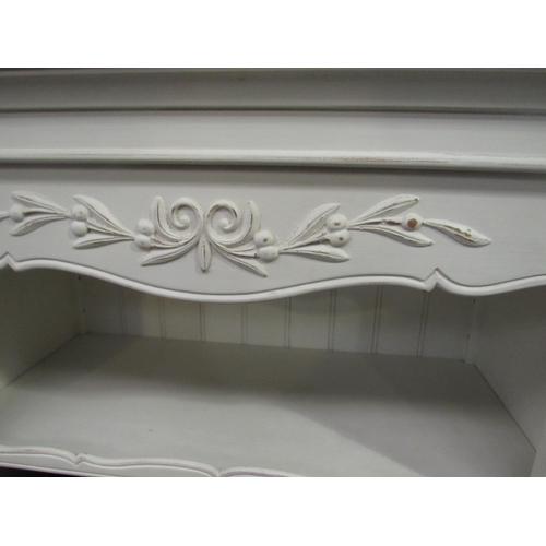 1054 - A white painted Victorian style French bookshelf on turned fore legs, 132cm high x 84cm wide x 40cm ... 