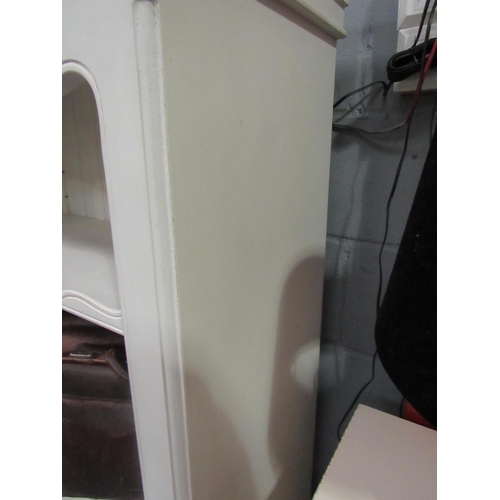 1054 - A white painted Victorian style French bookshelf on turned fore legs, 132cm high x 84cm wide x 40cm ... 