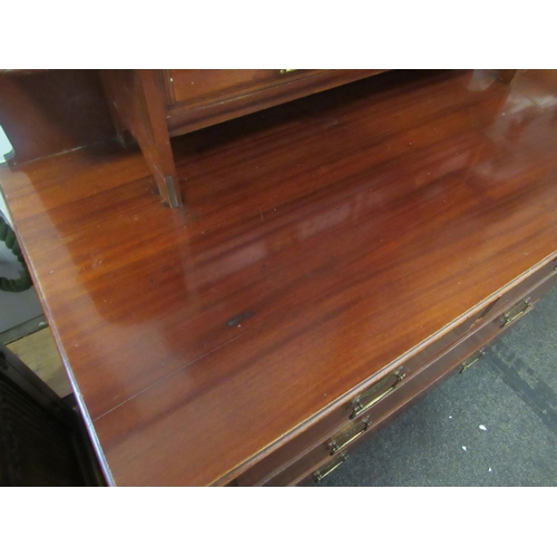 1063 - An Edwardian mahogany dressing chest, the tilt mirror over six drawers, 165cm high x 106cm wide x 52... 