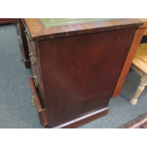 1065 - Circa 1900 a mahogany twin pedestal desk the gilt tooled leather writing surface over nine drawers o... 