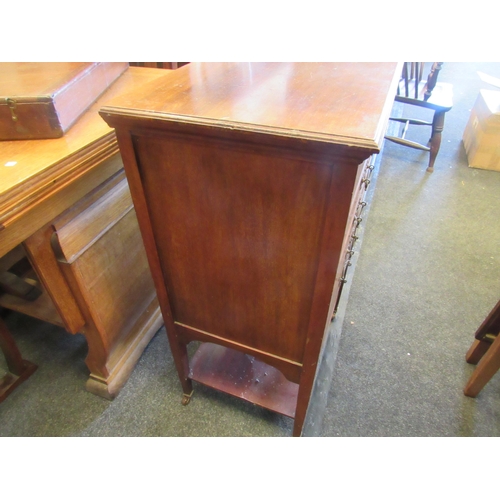 1085 - A mahogany five drawer music cabinet with undertier on castors, 83cm high x 52cm wide x 38cm deep