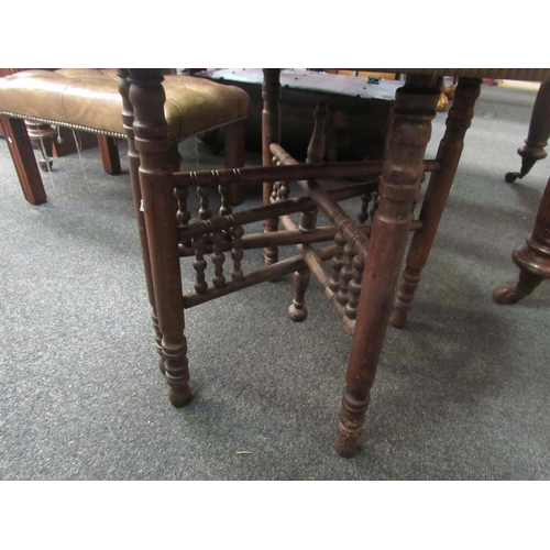 1098 - An Eastern folding table with circular brass dish of Islamic influence