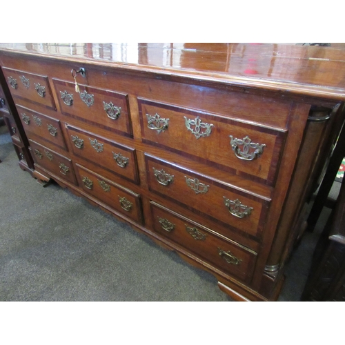 1101 - A 19th Century mahogany false front chest of three lower drawers with lift-up top and on bracket fee... 