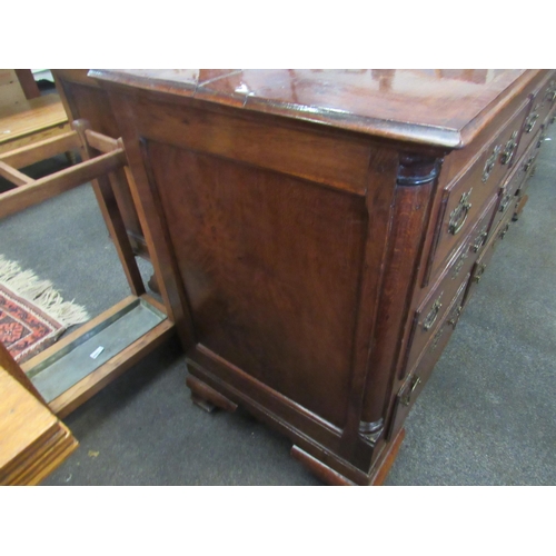 1101 - A 19th Century mahogany false front chest of three lower drawers with lift-up top and on bracket fee... 