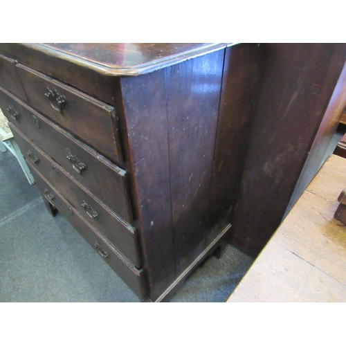 1110 - A Georgian oak country chest of two short over three long graduating drawers, brass shaped handles, ... 