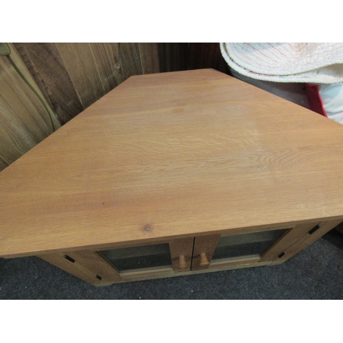 1145 - A light oak corner television unit, 55cm high x 95cm wide x 47cm deep