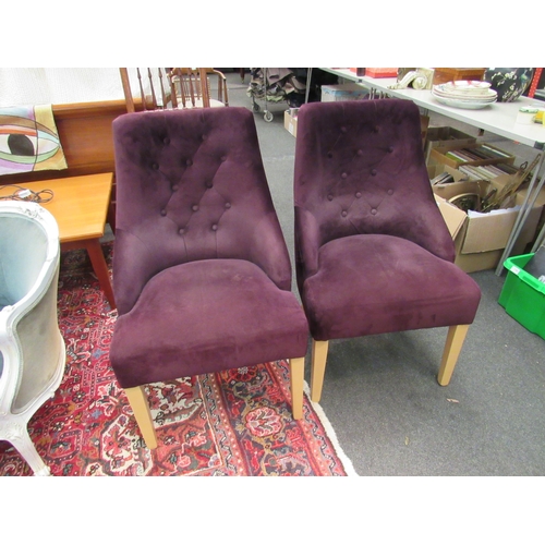 1158 - A pair of button back armchairs with oak supports