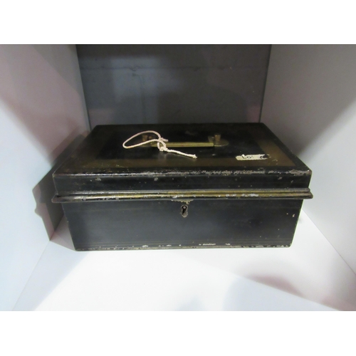 1258 - A bygone cash box with assorted worldwide coinage with key