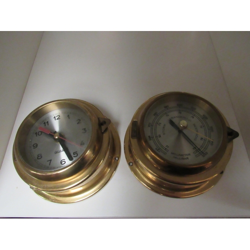 1334 - A brass ship’s style barometer and clock