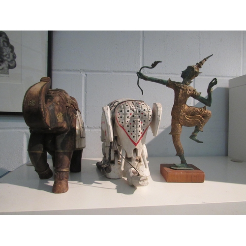 1366 - A painted wooden elephant puppet, another elephant and a gilt and metal figure of deity (3)