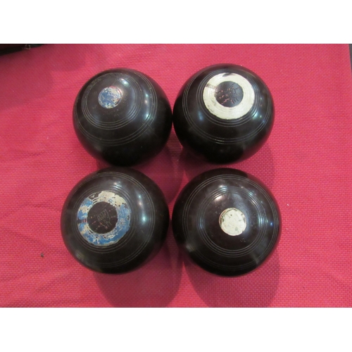 1391 - A case containing four lawn bowls  (R)  £10