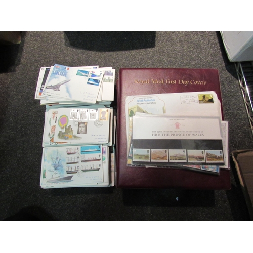 1402 - A box containing three albums of Royal Mail First Day covers and a quantity of stamps