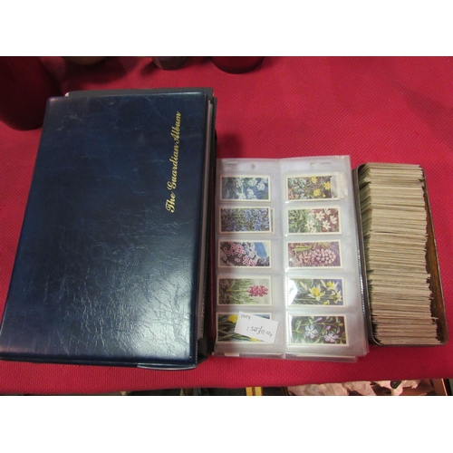 1405 - A box of loose cigarette cards and three albums of sets