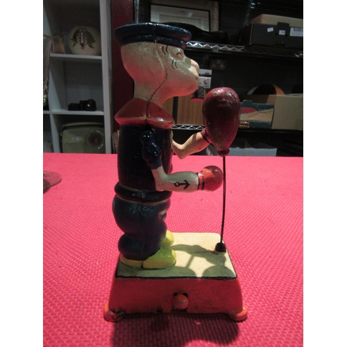 1448 - A vintage cast iron articulated toy, Popeye with pipe, boxing, 19.5cm high  (R)  £30