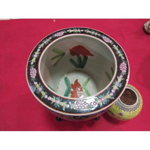 1454 - An Oriental jardiniere with goldfish decoration internally on stand and a ginger jar (2)