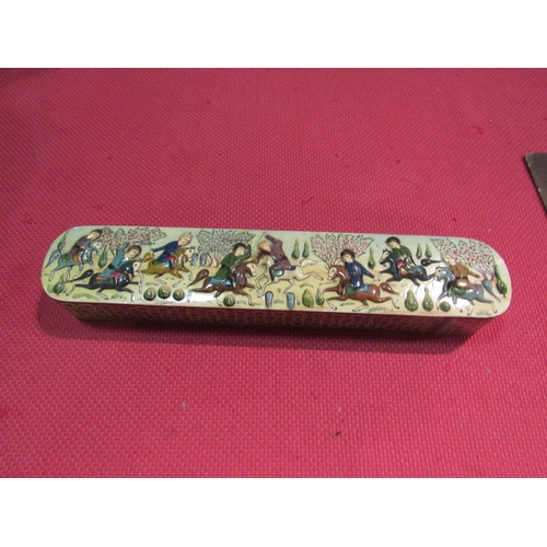 1458 - A sliding pen box embossed with figures on horseback, 33cm long