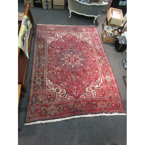 1480 - A red and blue ground wool rug with geometric design, multiple borders and tasselled ends, 290cm x 2... 