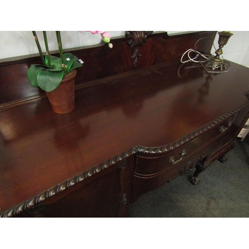 1008 - A 19th Century mahogany breakfront sideboard, with two central drawers flanked by two cupboards, one... 