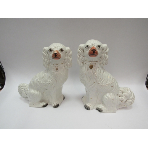 1425 - A pair of white Staffordshire dogs