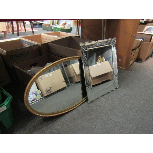 1433 - A Venetian style wall mirror and a gilt framed oval wall mirror