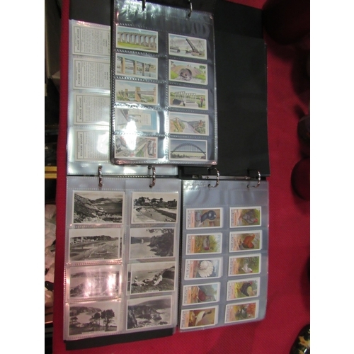 1405 - A box of loose cigarette cards and three albums of sets