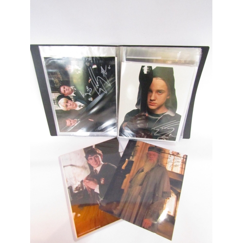 8134 - HARRY POTTER INTEREST: An album of publicity photographs from the Harry Potter film series signed by... 