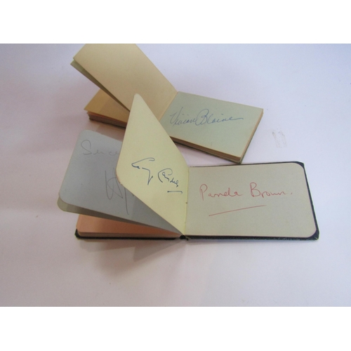 8134A - Four 1950's autograph books containg various signatures including Audrey Hepburn and Orson Welles