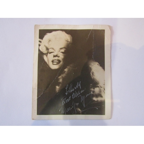 8135 - MARILYN MONROE: A black and white publicity photgraph of the film star and sex symbol, bearing autog... 