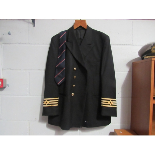 1083 - A Merchant Navy Captain's jacket with trousers, a peaked cap and epaulettes etc.