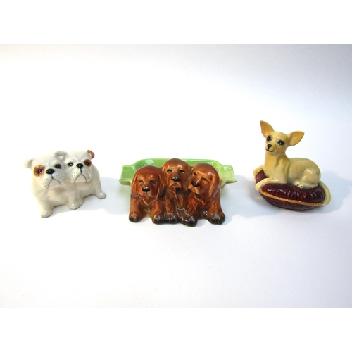 1879 - Three Beswick dogs, Chihuahua - lying on cushion, model no. 2454, Bulldogs - seated, model no. 3384 ... 