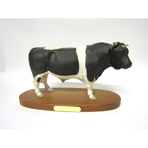 1903 - A Royal Doulton Friesian Bull - on wooden plinth, model no. A2580