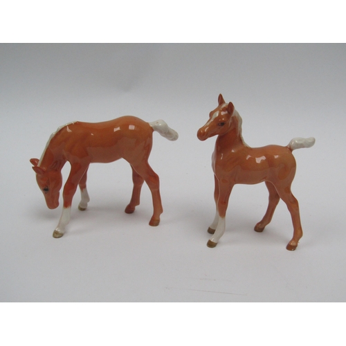 1912 - A Beswick Arab Foal in Palomino gloss, model no. 1407 (tail restored) together with a Beswick grazin... 