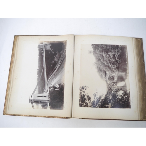 9101 - A late 19th Century photograph album containing 60+ mounted albumen print photographs, mainly UK and... 