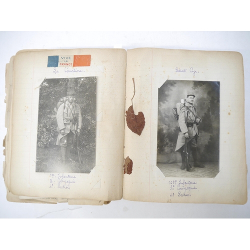 9105 - A World War 1 souvenir album containing photographs, postcards, manuscript pen & ink sketches and en... 